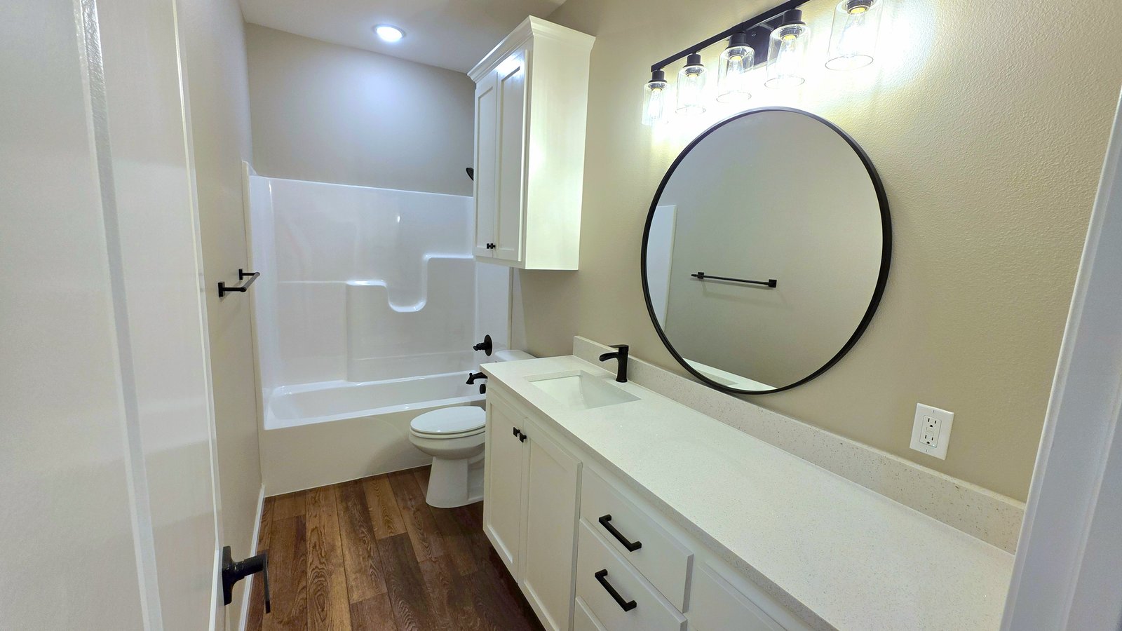 Bathroom remodel with double vanity and round mirrors