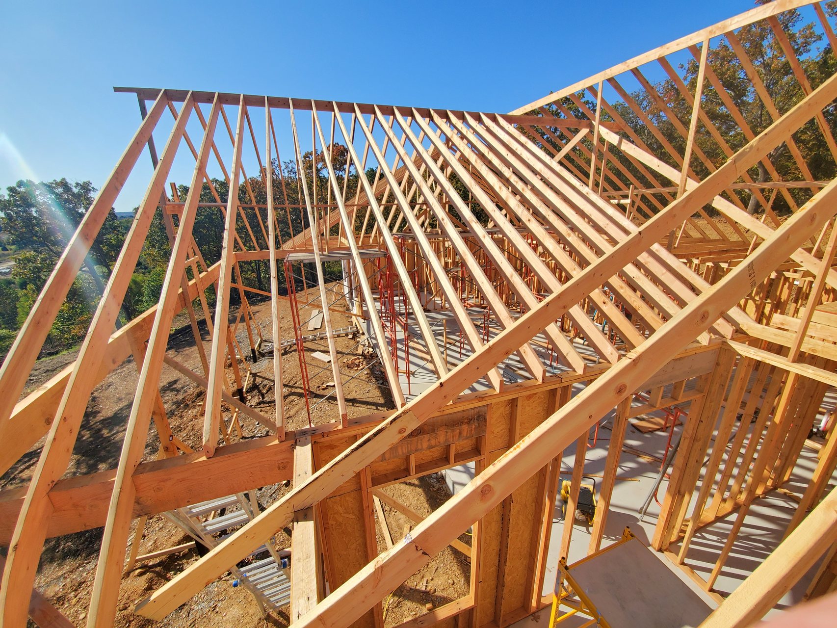 Close view of roof framing and floor structure on a Baker Construction custom home