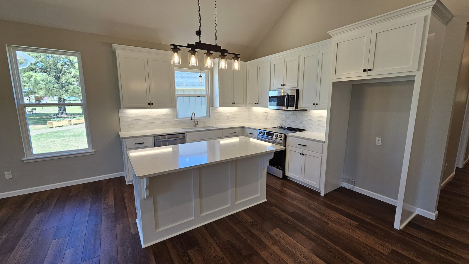 Modern kitchen with white cabinets and island
